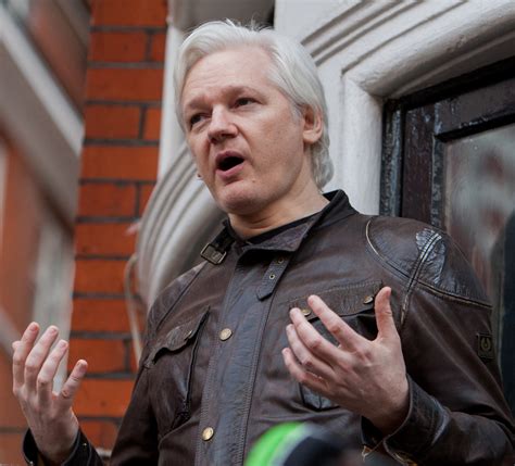 what was julian assange charged with